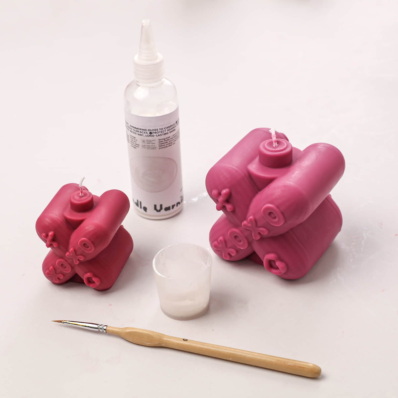 Magenta XOXO candles with candle varnish and paintbrush for glazing details - Boowan Nicole