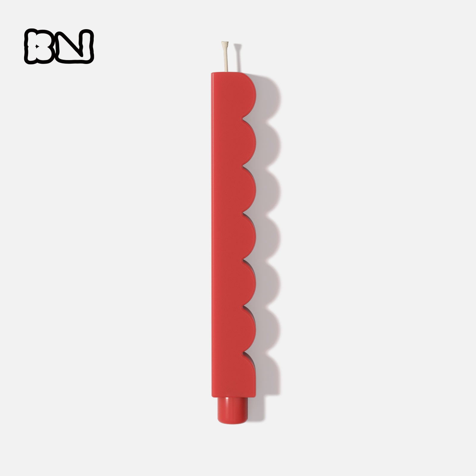 Red wave taper candle on white background