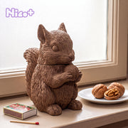 Studio82 x Boowan Nicole Acorn Hug Squirrel Candle Jar Silicone Mold - squirrel-shaped candle jar hugging an acorn on a windowsill