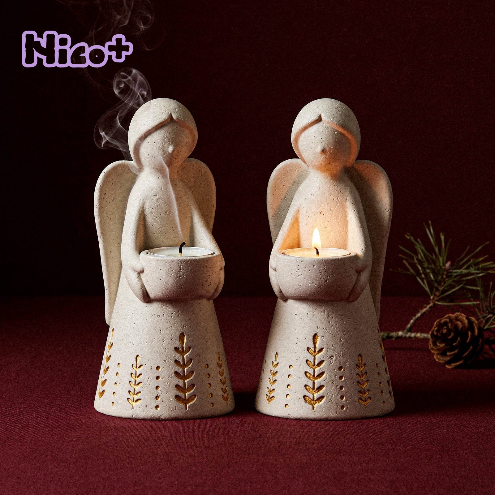 Azulmostaza x Boowan Nicole Angel of Light Tealight Holder Silicone Mold - two lit angel tealight holders with gold leaf-and-dot embossed skirts
