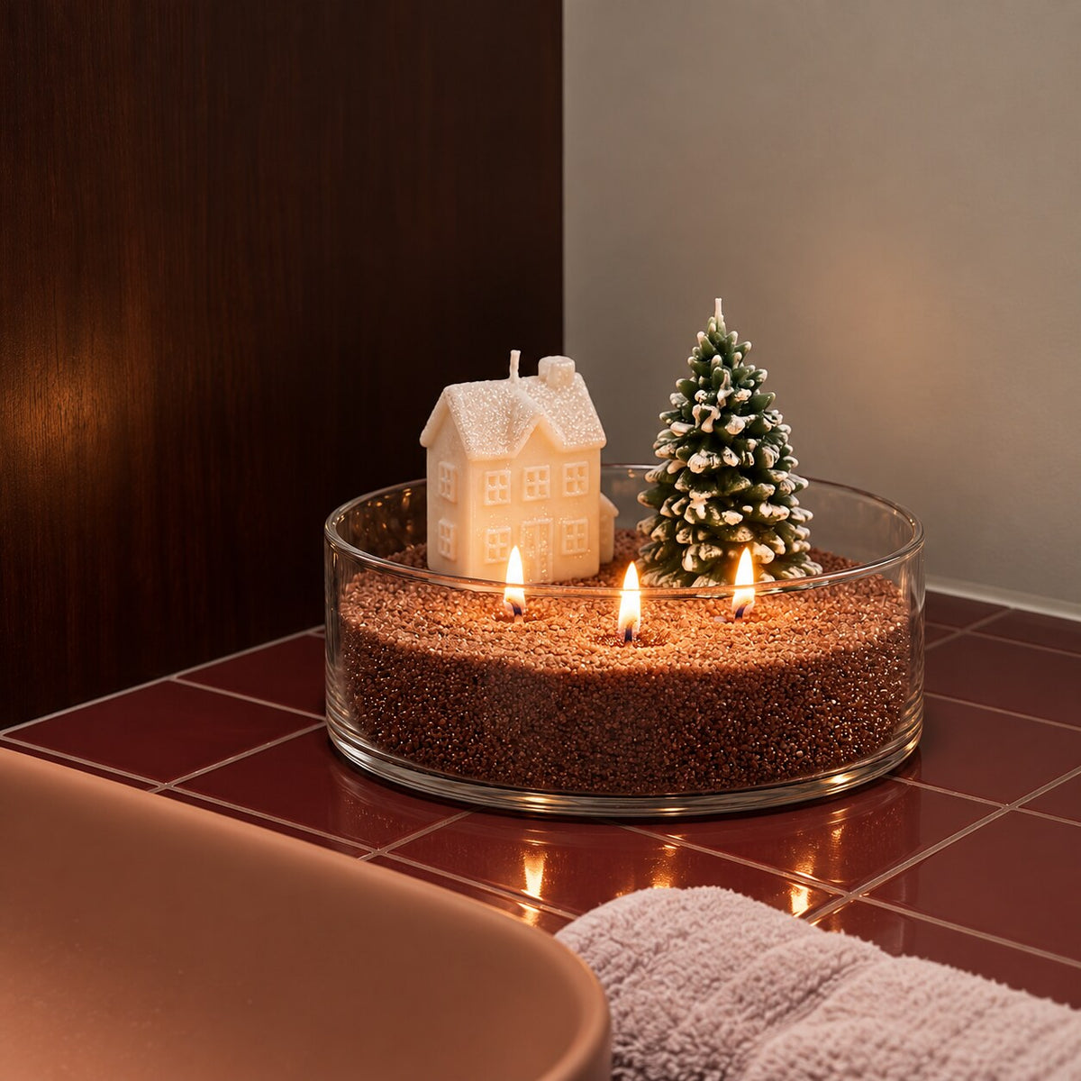 Glass bowl of Warm Cocoa sand wax with a house candle and mini tree