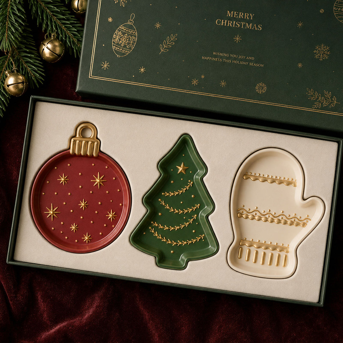 Ornament, tree and mitten trays displayed in a green Merry Christmas gift box