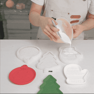 Animation of pouring colored cement into the Christmas tray silicone molds
