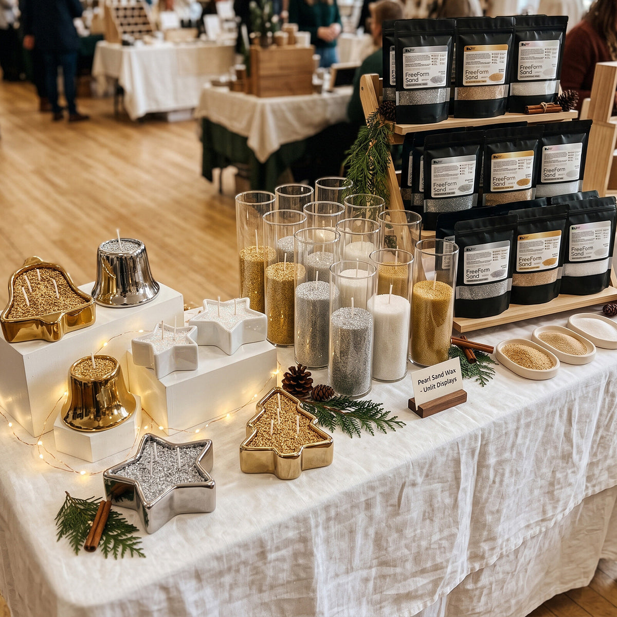 Christmas market booth displaying pearl sand wax bags and styled candles