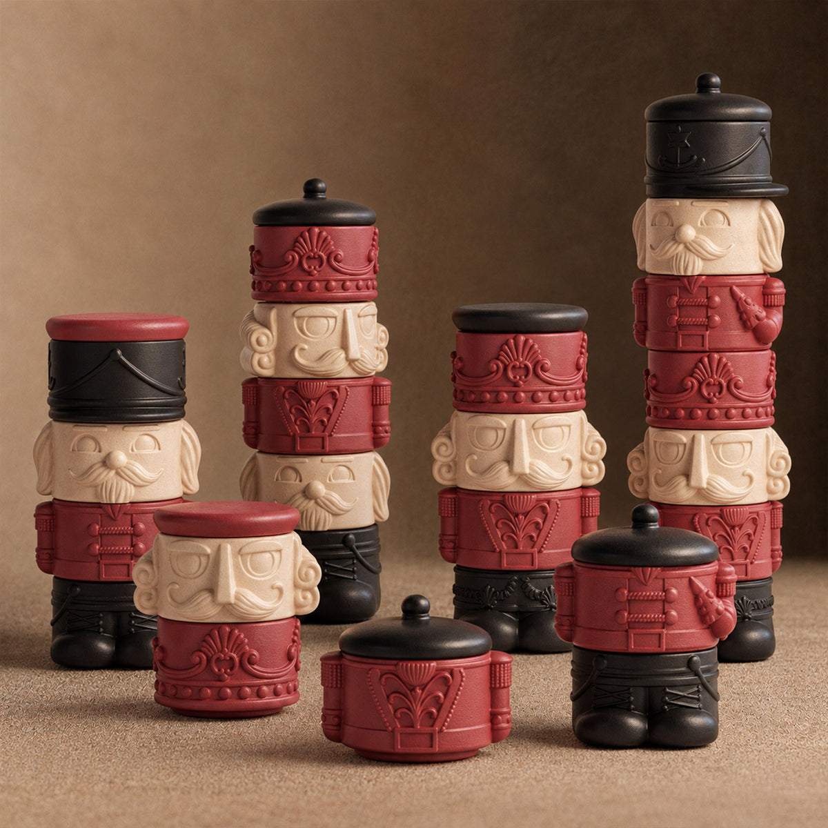 Maker packing nutcracker candle jars in a holiday studio