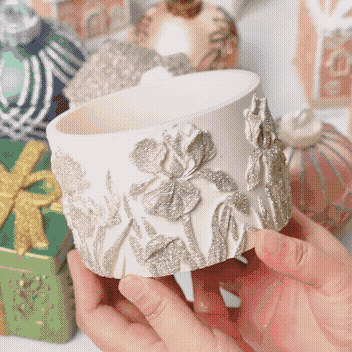 Silver eco glitter sparkling on a plaster floral candle vessel
