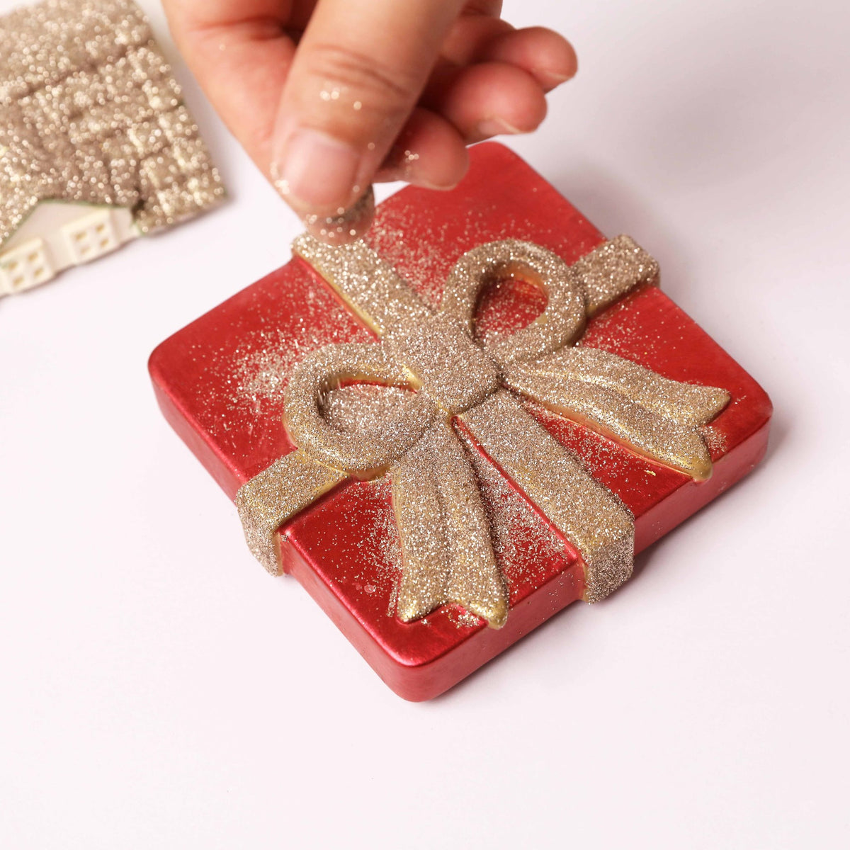 Red gift box casting with champagne gold glitter bow