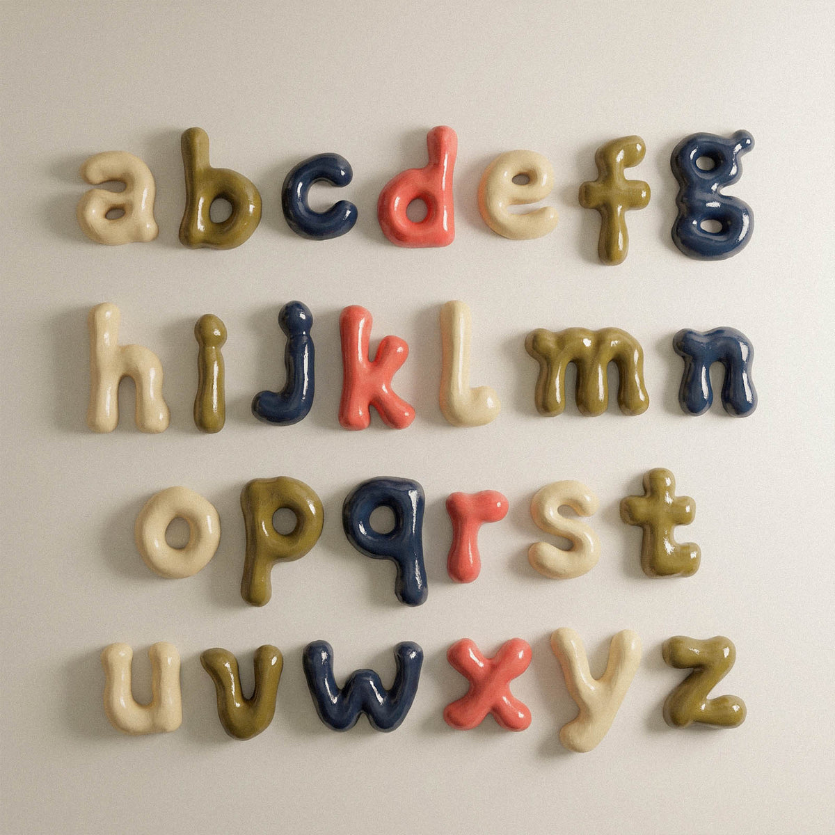 Colourful rounded lowercase alphabet letters displayed from a to z on a wall