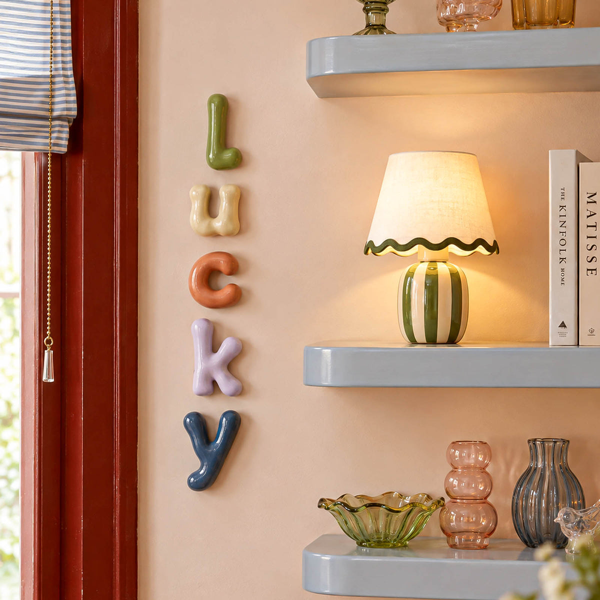 Lowercase letters spelling lucky beside home decor