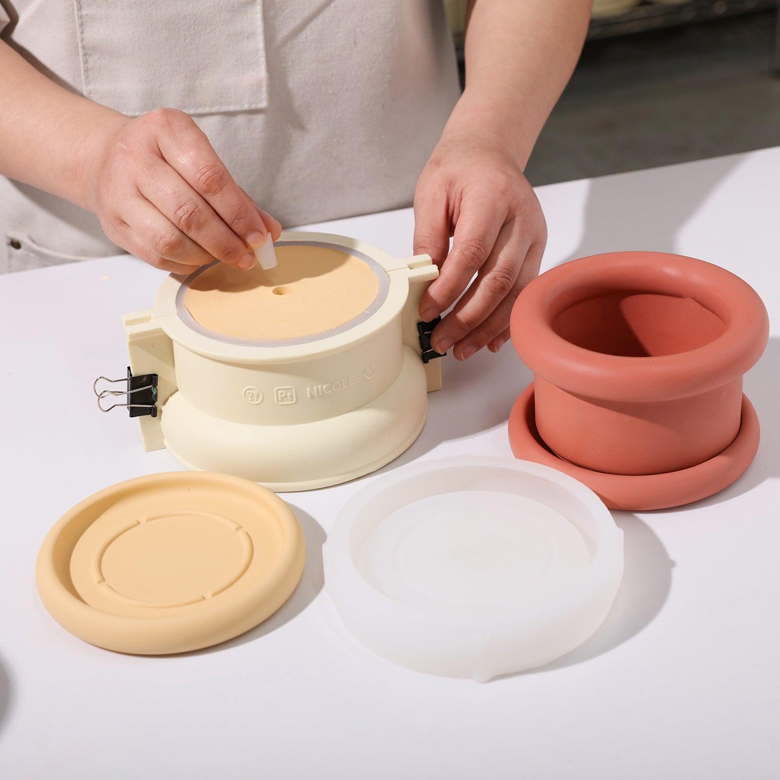 Place the silicone plug into the boowannite material in the silicone mold to reserve the drainage hole for the Short Botanic Column Plant Pot -Boowan Nicole