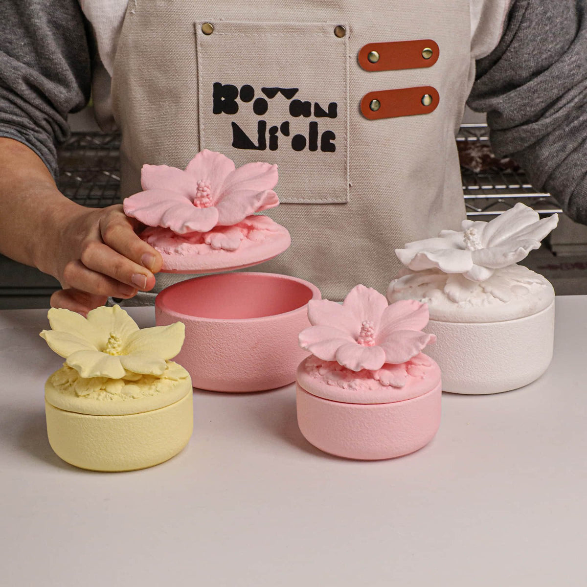 Finished pink, yellow and white hibiscus jars with silicone molds