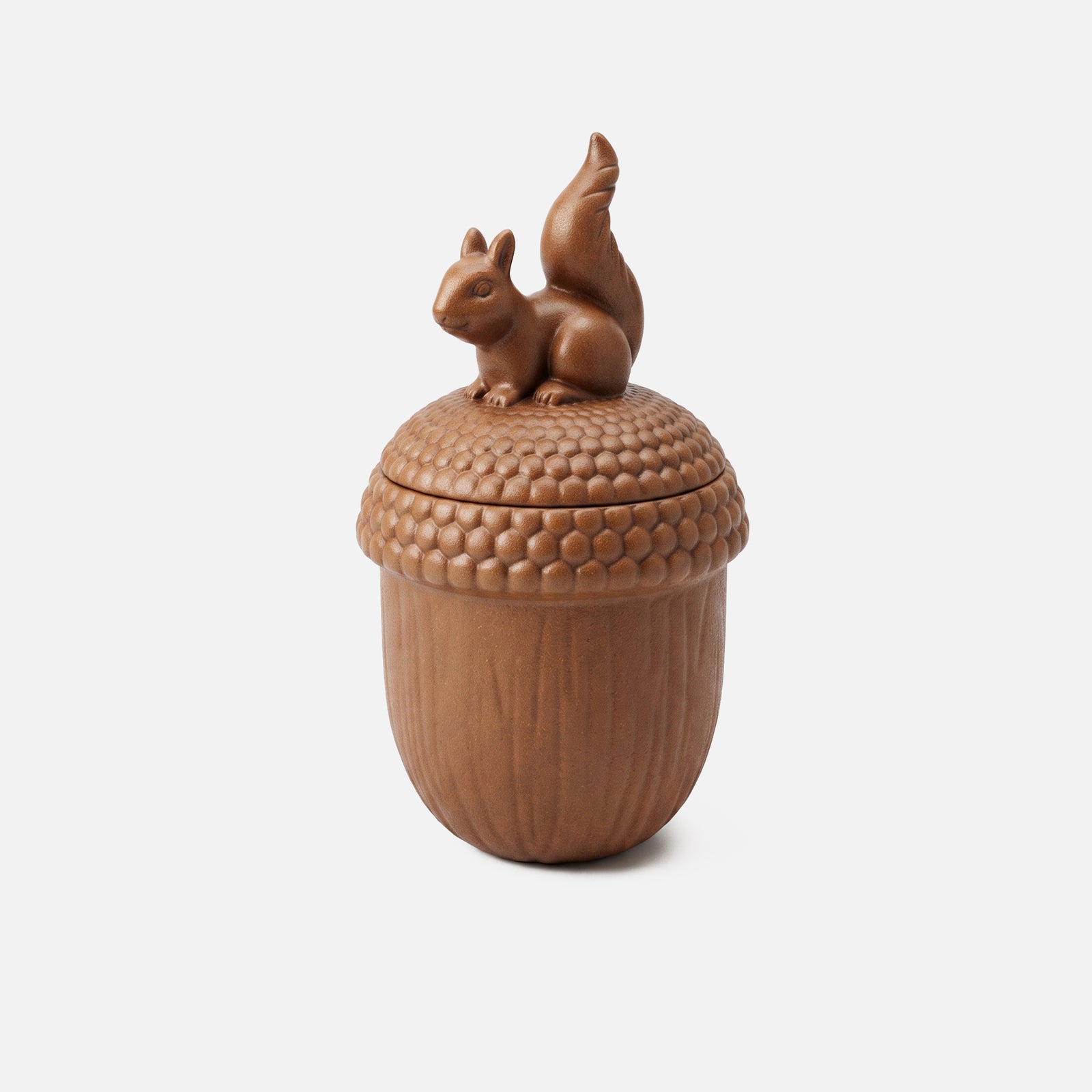 A squirrel acorn candle jar silicone mold in terracotta, with a sculpted squirrel finial on the lid.
