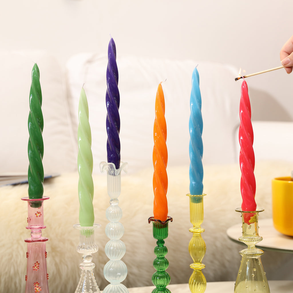 Light the red Spiral Taper Candle in the candle holder on the table - Boowan Nicole