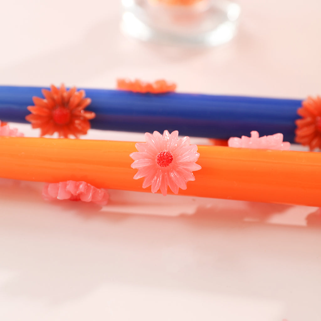 Daisy embellishments come to life on yellow taper candles-Boowan Nicole