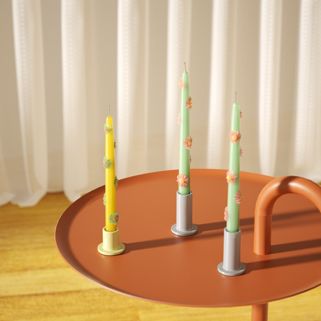 Teal and yellow daisy decorative tapered candles in candle holder on coffee table - Boowan Nicole