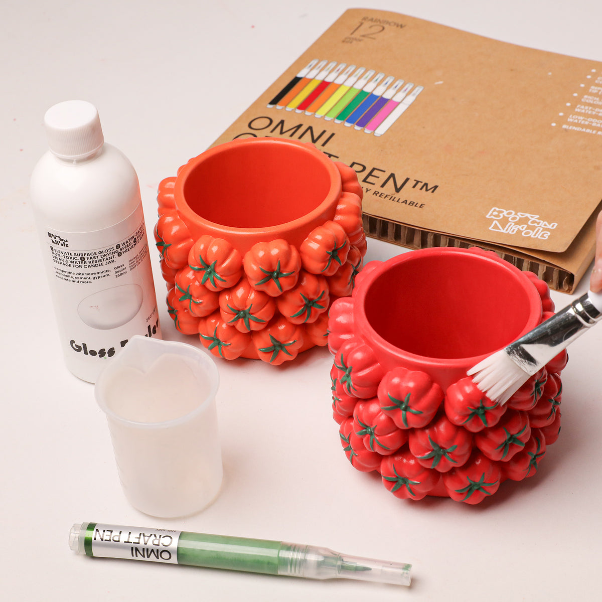 Red and orange tomato-cluster jars with acrylic markers, brushes and gloss sealer