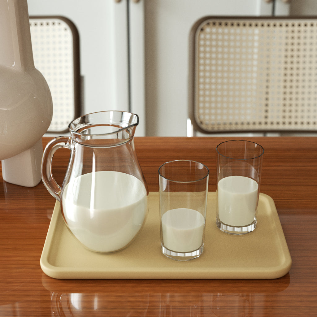 A glass jug and cup containing milk are placed on the tray - Boowan Nicole