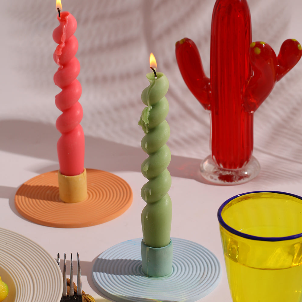 Experience the warm glow as Boowannicole's red and green Spiral Silicone Candles are gracefully lit, adding a touch of vibrant elegance to your space.