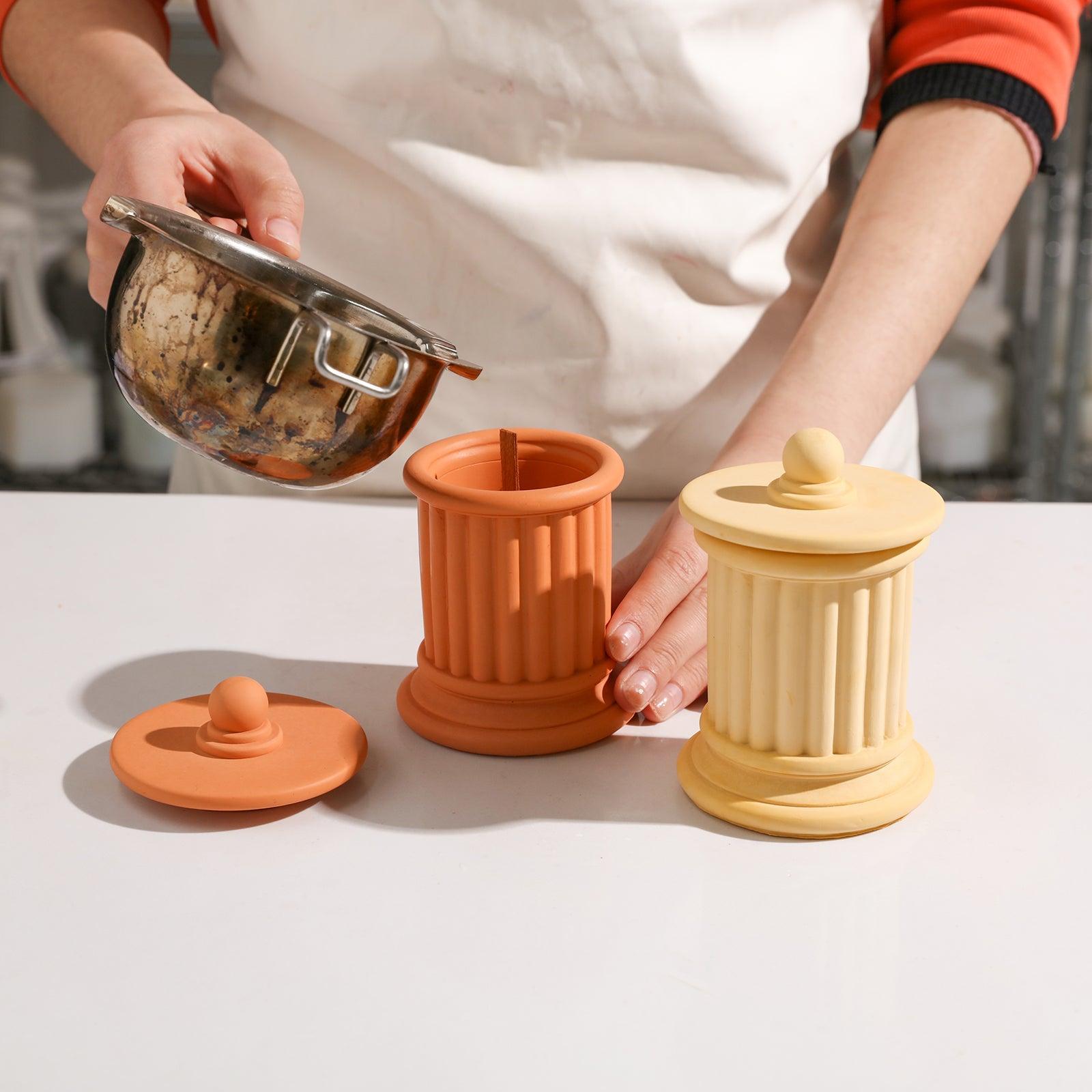 Pouring melted wax into the candle jar. Boowannicole's silicone molds contribute to crafting unique candles, combining elegance with creativity.