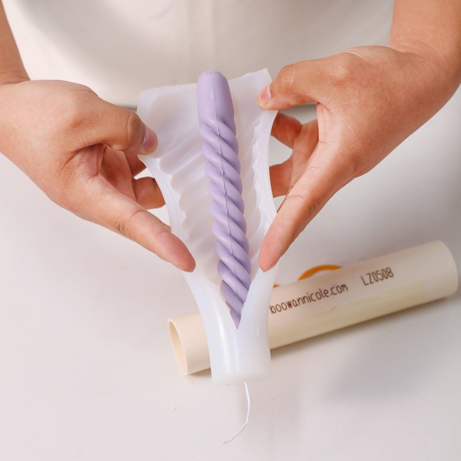 Effortlessly pouring wax into Boowannicole silicone molds, embodying the seamless experience of our brand.