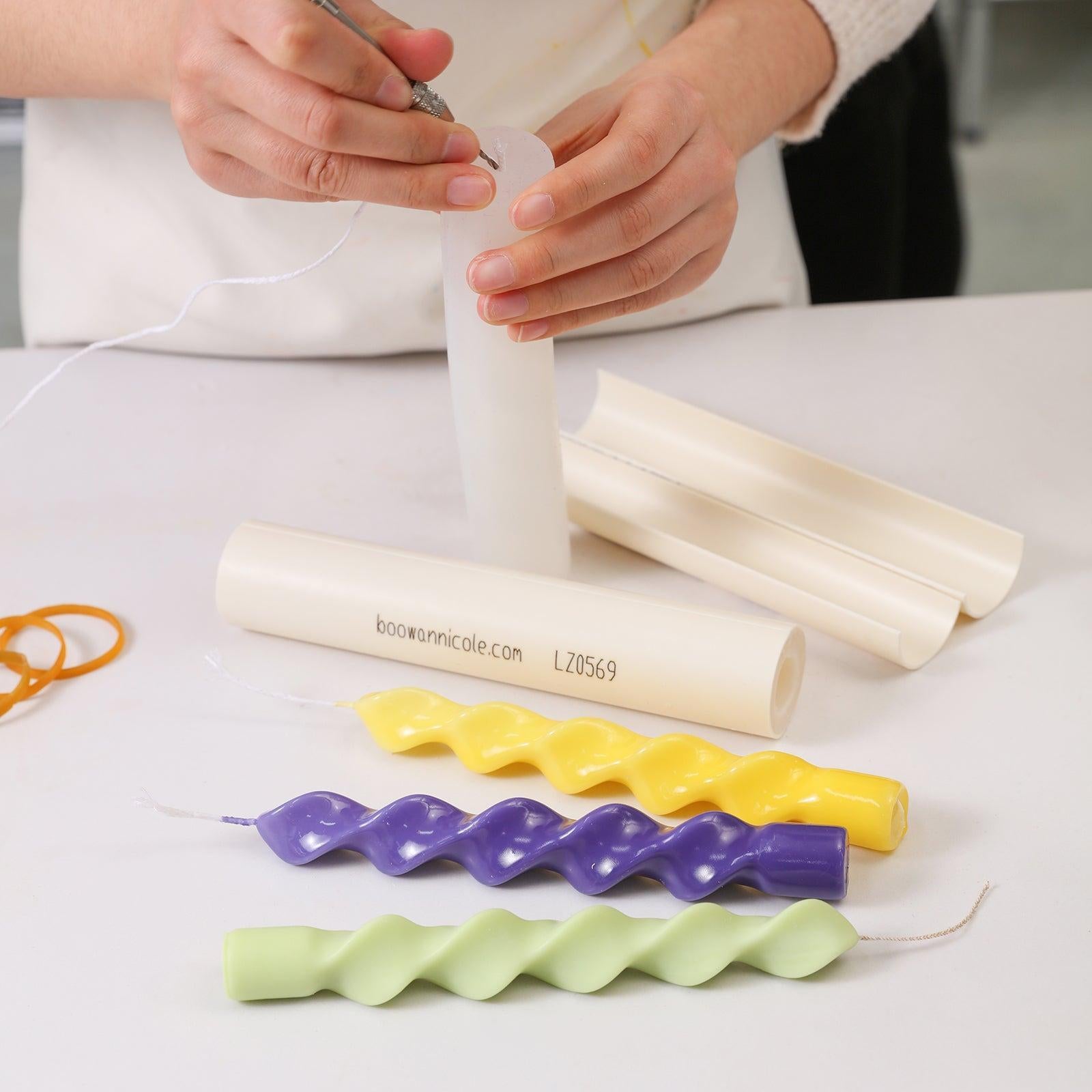 Placing the wick into Boowannicole's silicone mold.