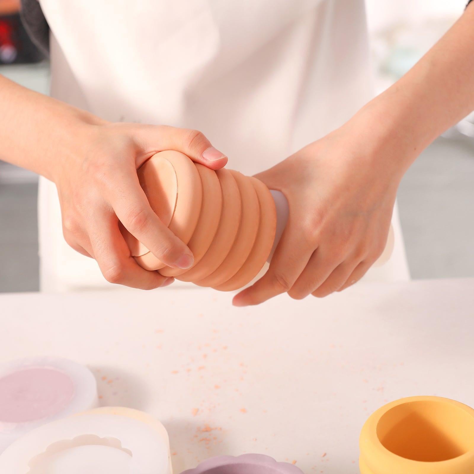 After the material solidifies, easily demolding the candle jar crafted with Boowannicole silicone molds. Unique design showcases the effortless and efficient crafting process.