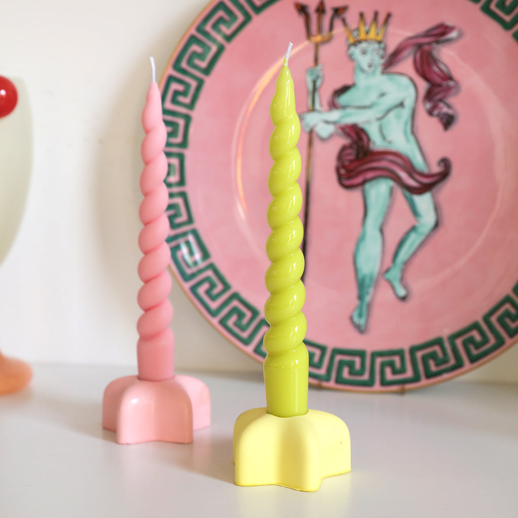 Adorn your space with elegance - Boowannicole presents a Pink and Yellow Spiral Taper Candle duo delicately placed on stylish candle holders, a testament to craftsmanship.