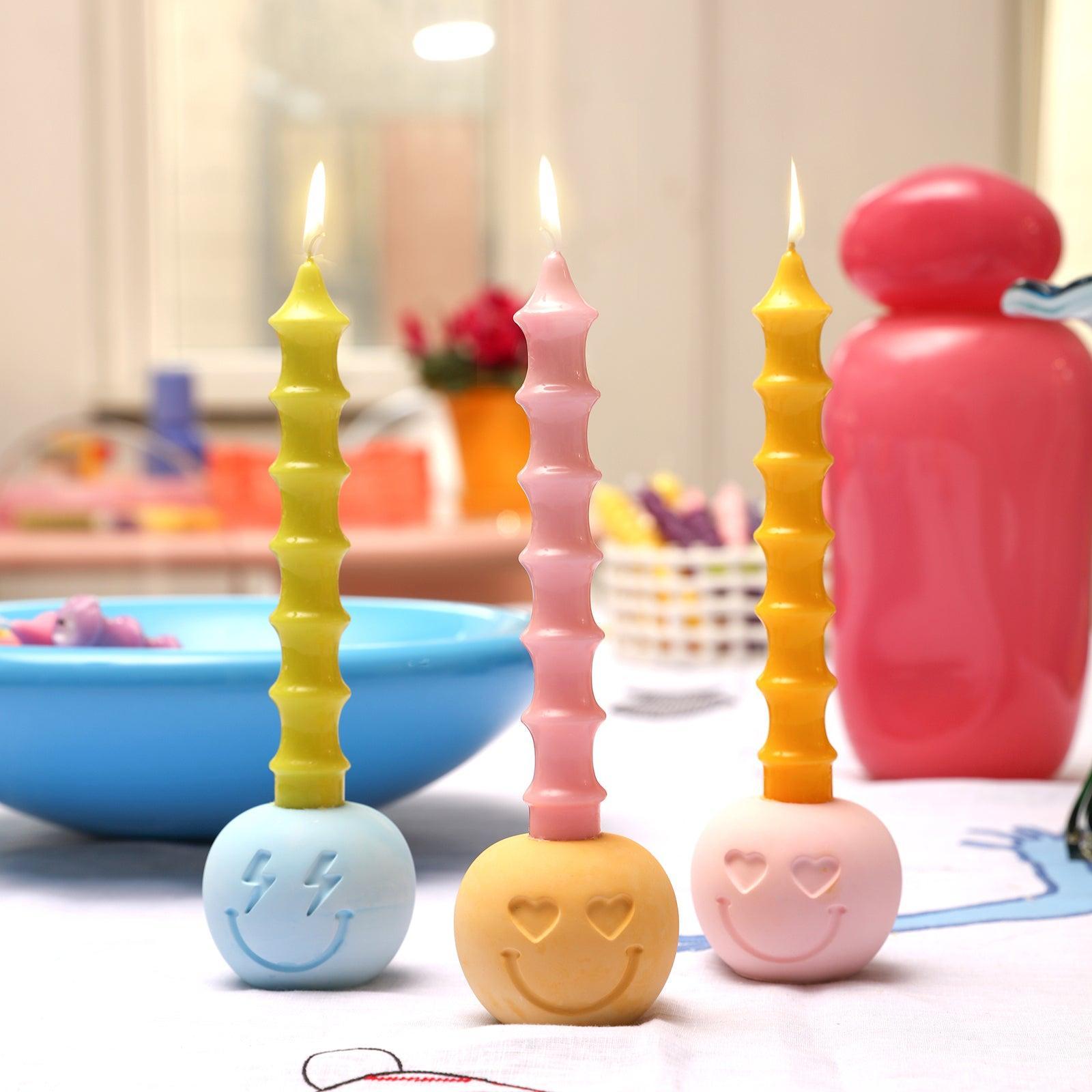 Create an enchanting atmosphere - Boowannicole's trio of lit candles, elegantly placed on a candle holder, adorning your table with warmth and style.