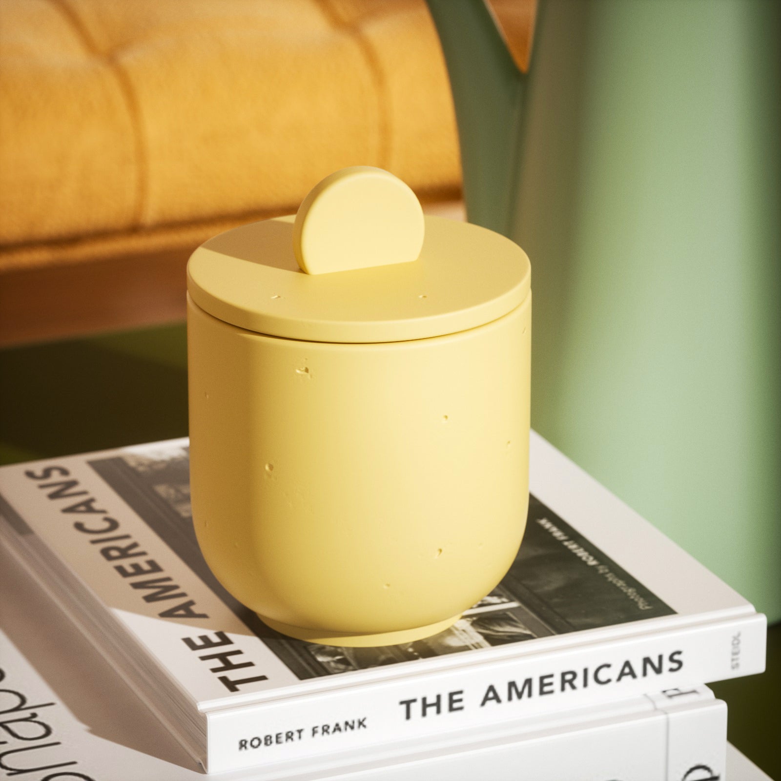 Static presentation of a yellow candle jar, capturing the serene elegance of Boowannicole.