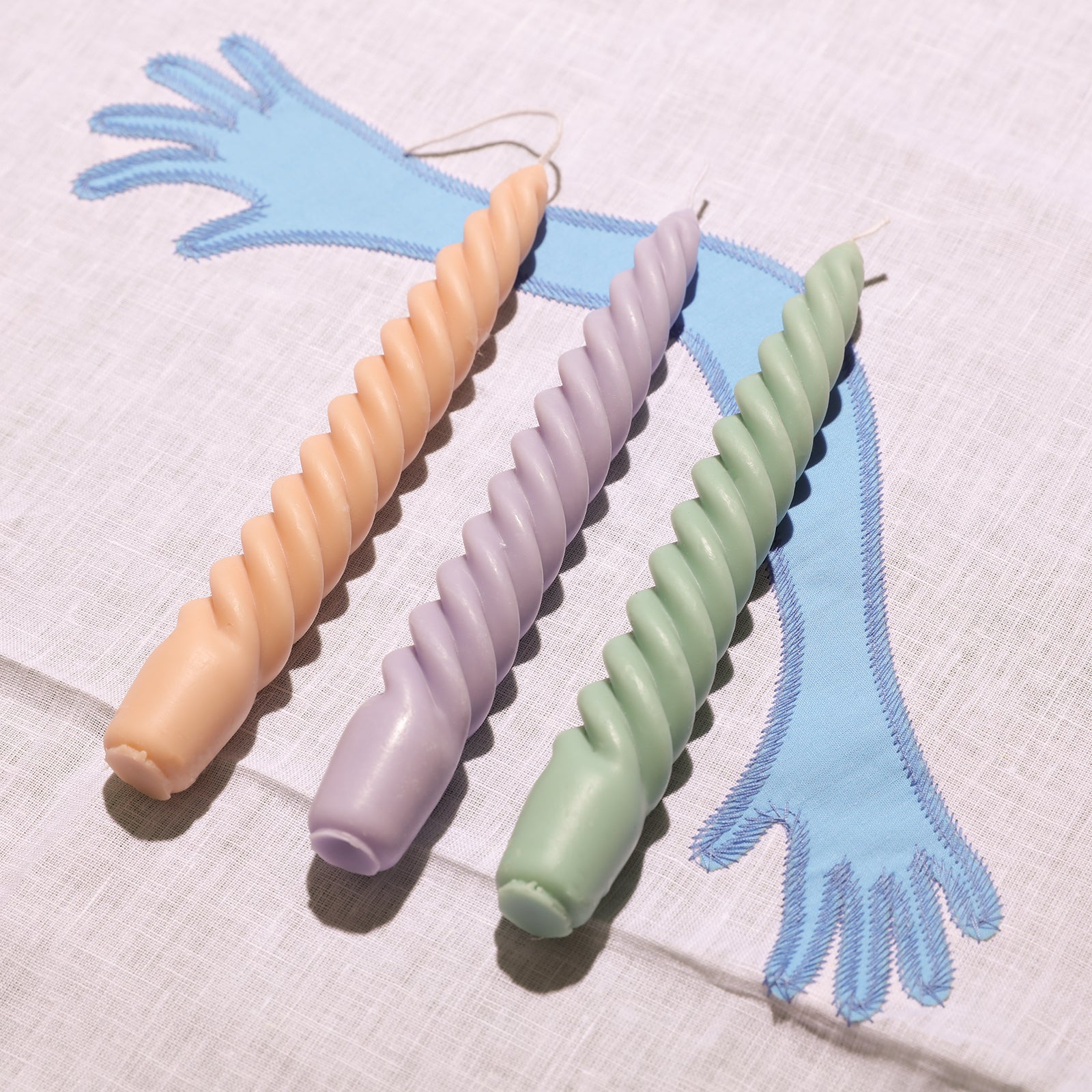 Crafting three taper candles using Boowannicole silicone molds.