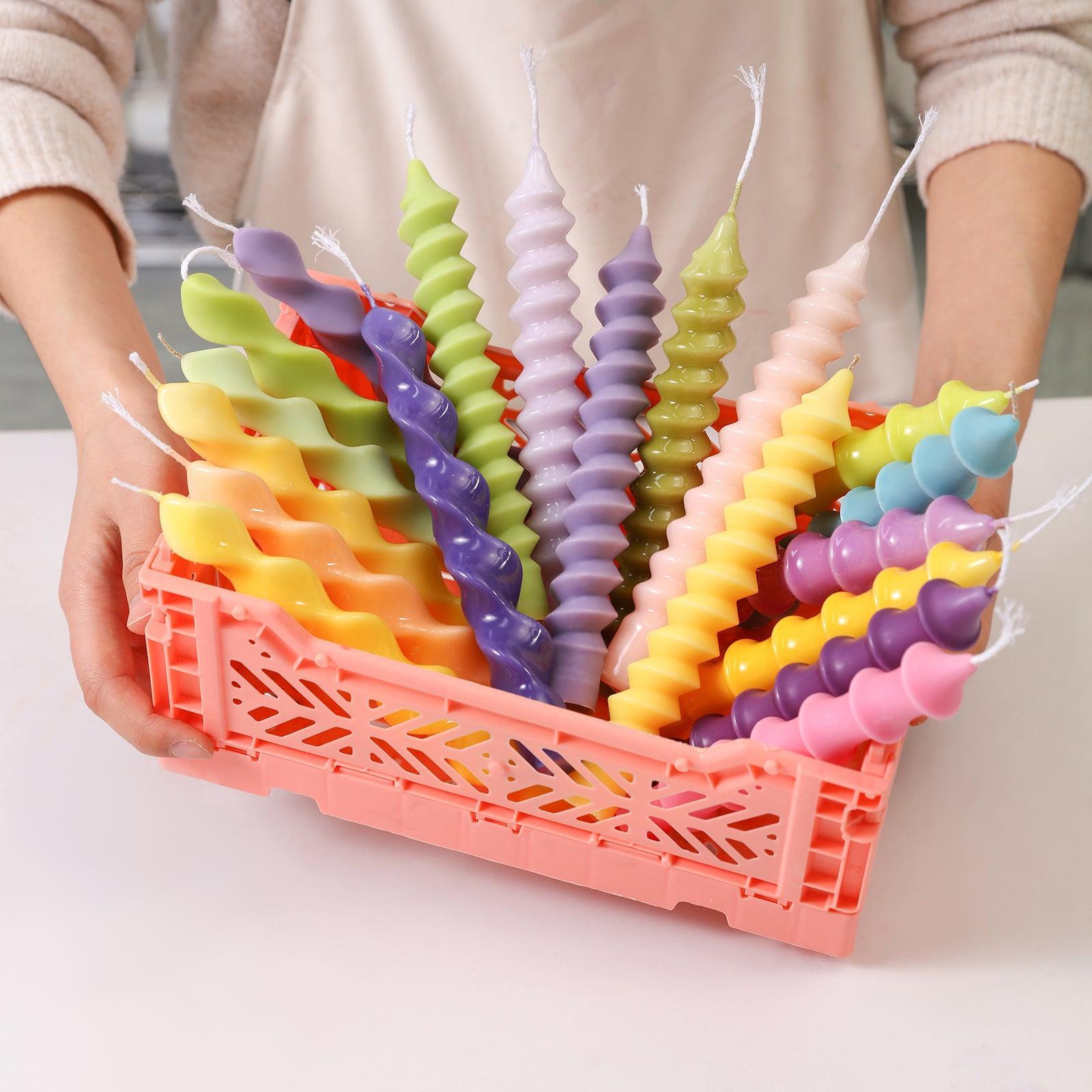 Diverse expressions of art - Boowannicole presents an array of uniquely shaped candles in different colors, delicately arranged in a charming basket.