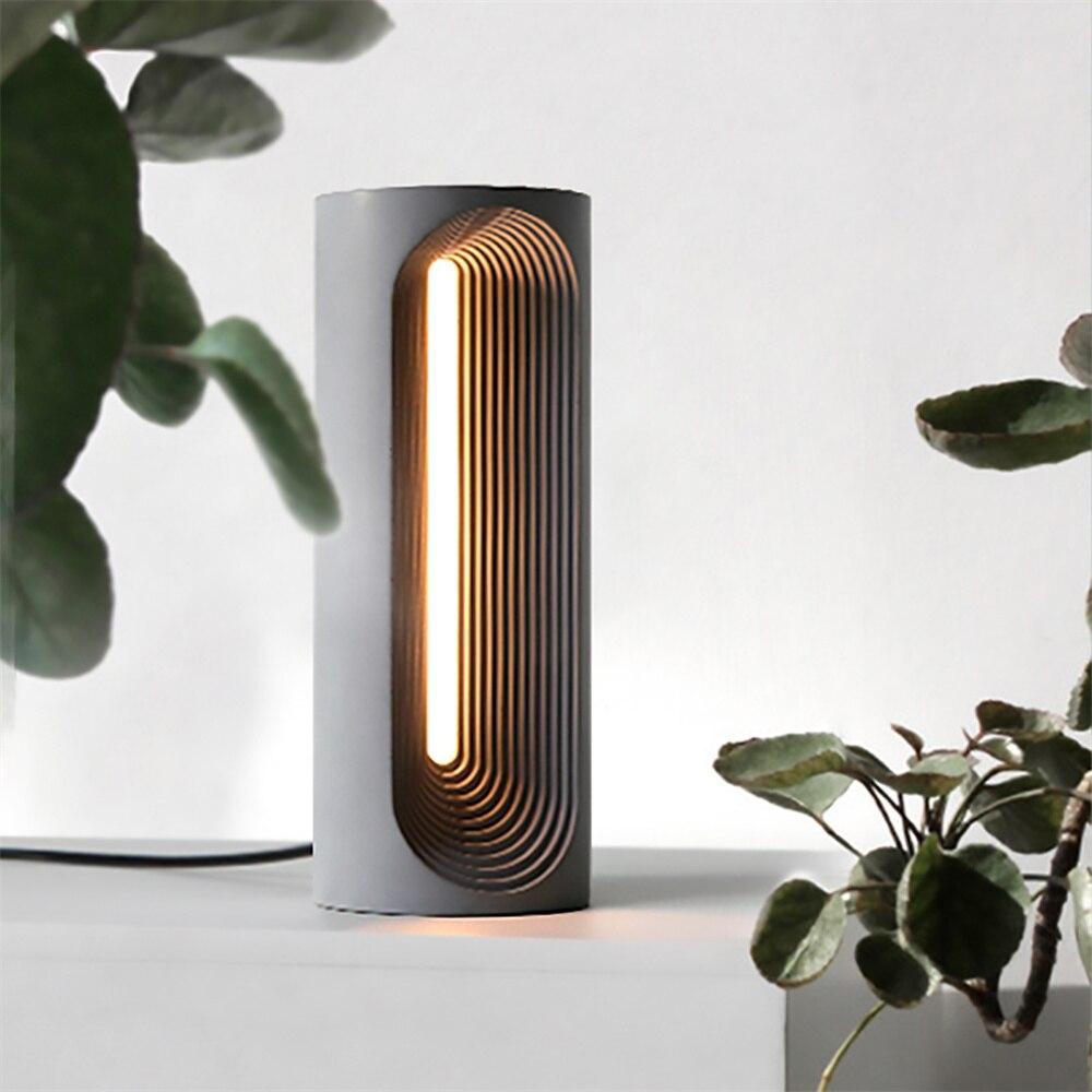 Capture the essence of craftsmanship – a static display showcasing the finished concrete table lamp, a testament to Boowannicole's dedication to creating artful pieces.