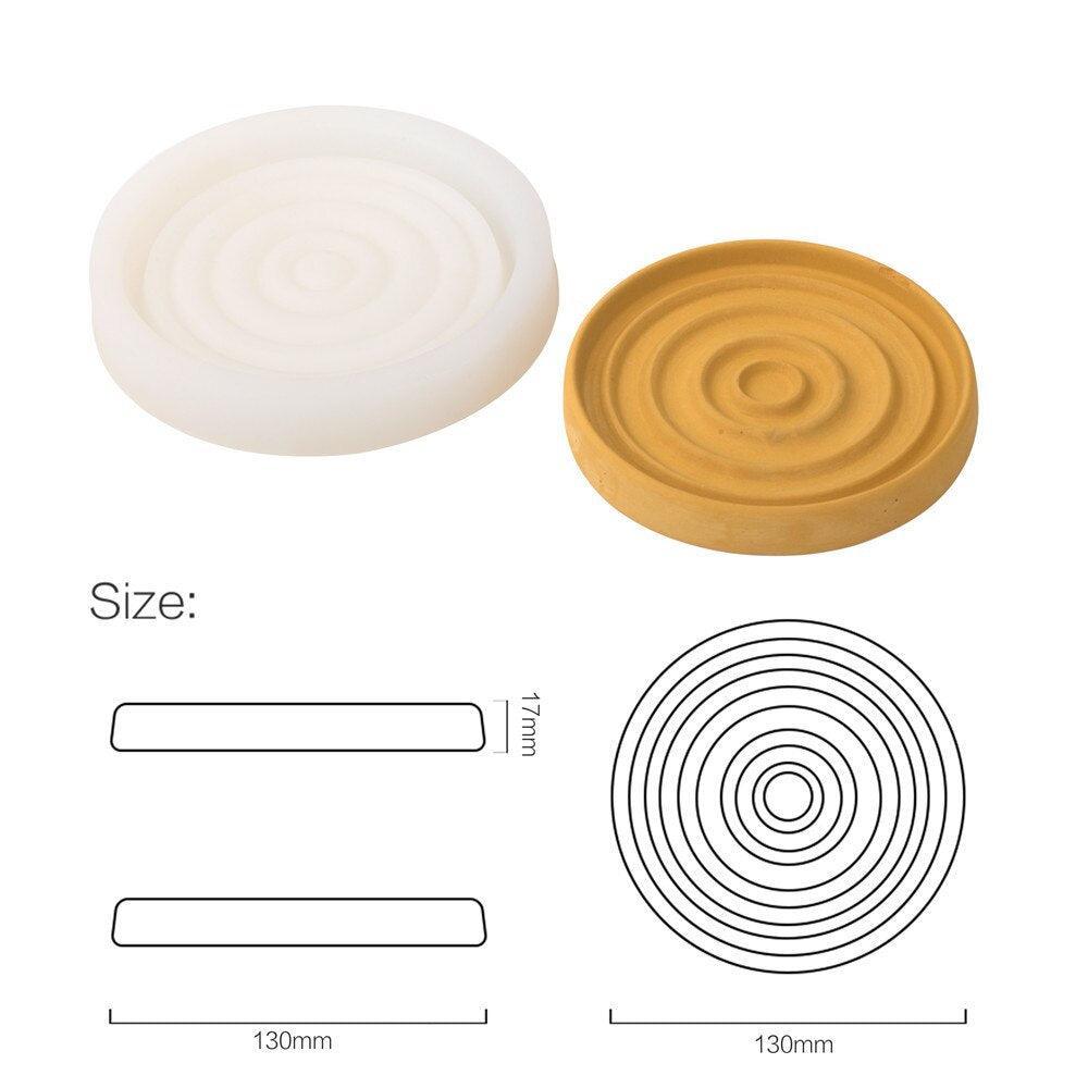 Display of silicone molds and yellow circular soap dish, highlighting boowannicole's uniqueness in color coordination and shape design.